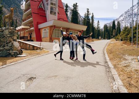 Tourists have fun after a hike. International mountain day concept. Bishkek, Kyrgyzstan - April 9, 2019 Stock Photo