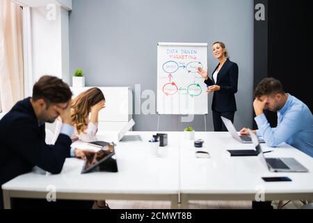 Lazy Bored People Sleep In Office At Work Stock Photo