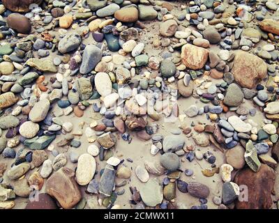 colored stones and sand in the background Stock Photo