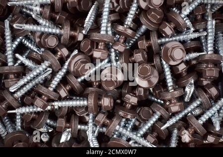 Tapping screws for mounting metal roof as a background Stock Photo