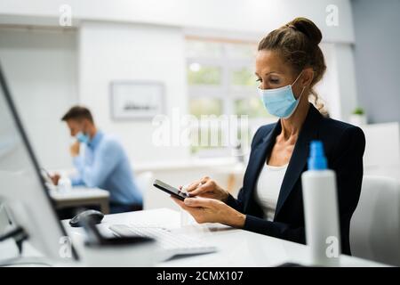 Cleaning Smartphone Gadget. Wiping Mobile Phone Screen Stock Photo