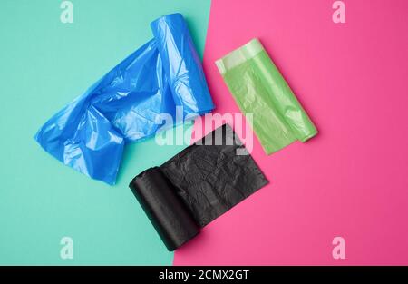 three rolled up rolls with plastic garbage bags Stock Photo