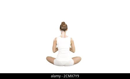 Beautiful young woman wearing sportswear practicing yoga sitting in lotus pose on white background. Stock Photo