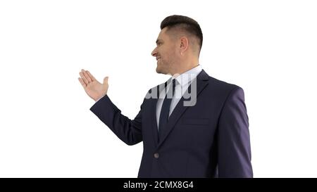 Business man pointing on product and talking to camera on white Stock Photo
