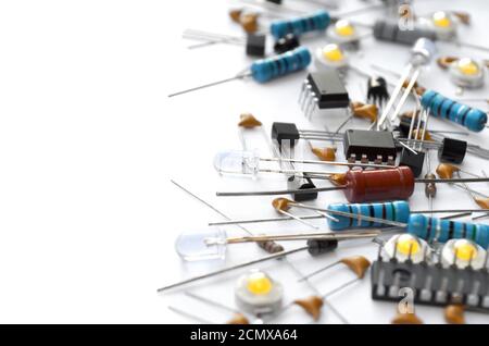 Various electronic components on white background with copy space. Close-up, selective focus Stock Photo