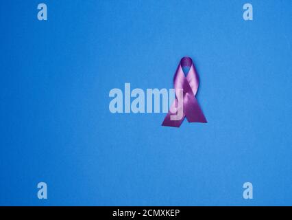 purple ribbon as a symbol of early research and disease control, Alzheimer's disease Stock Photo