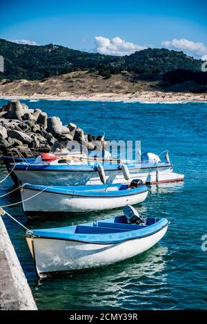 A close up of boats tied up to a dock in Black Sea. Letters on the boats says BS (Burgas) and Martin. Stock Photo