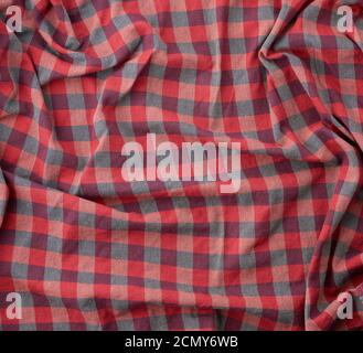 red checkered fabric for sewing various clothes with waves Stock Photo