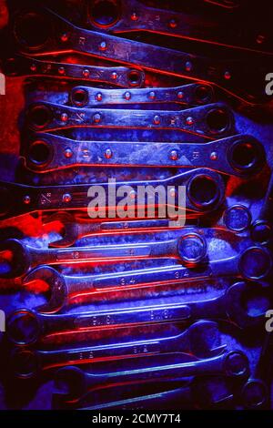 Set of mechanical or automobile repair tools illuminated in red and blue shades Stock Photo