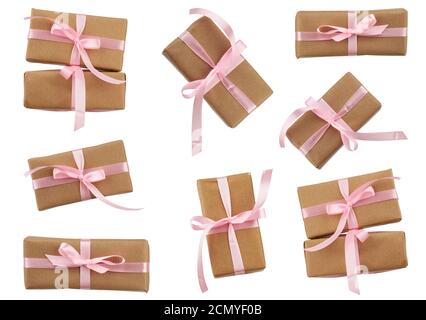 rectangular boxes wrapped in brown kraft paper and tied with a pink ribbon, gifts Stock Photo