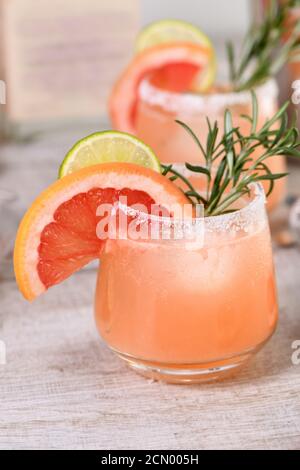 Cocktail fresh lime and rosemary combined with fresh grapefruit juice and tequila. A festive drink i Stock Photo