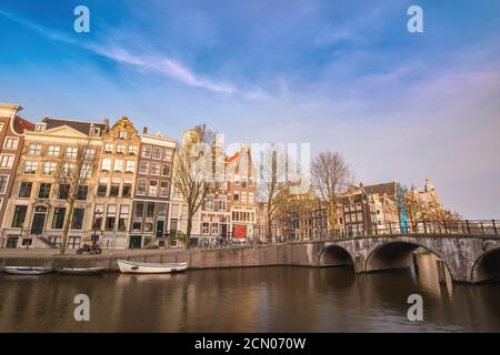 Amsterdam Netherlands, city skyline at canal waterfront and bridge with traditional house Stock Photo