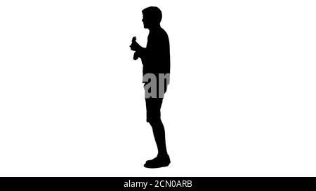 Silhouette Man with ukulele singing a song. Stock Photo