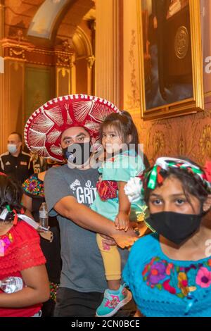 Lansing, Michigan - Activists rally in the Michigan State Capitol building, demanding that the legislature allow undocumented immigrants to get driver Stock Photo