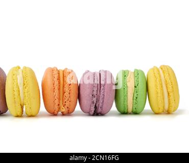 multicolored round baked macaroon cakes isolated on a white background Stock Photo