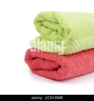 stack of colored cotton terry folded towels on a white background Stock Photo