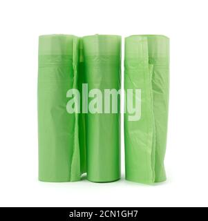 three rolls with green plastic bags for trash bin isolated on white background Stock Photo