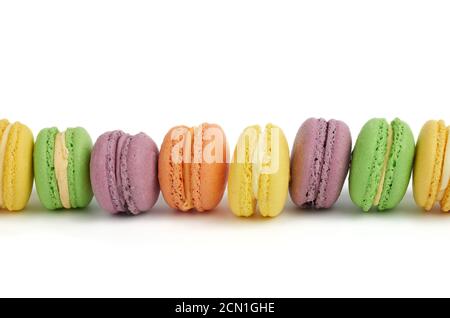 multicolored round baked macaroon cakes isolated on a white background Stock Photo