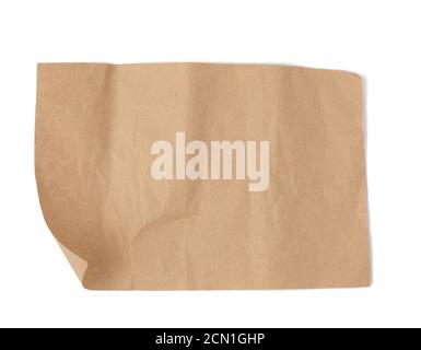 piece of brown parchment paper with torn edges isolated on a white background Stock Photo