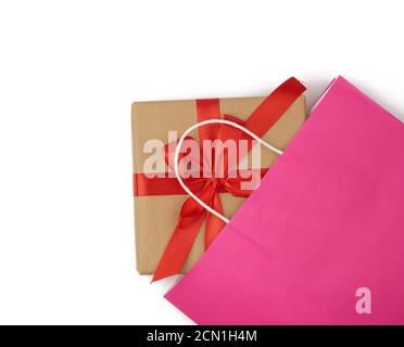 pink paper bag with a gift box on a white background Stock Photo