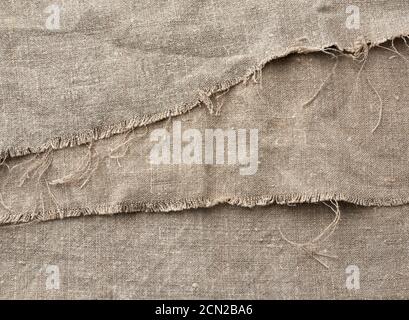 texture very old vintage gray linen fabric, full frame, rough antique canvas Stock Photo