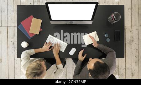 Two managers working discussing project on the screen of compute Stock Photo