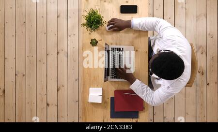 African american doctor working on laptop. Stock Photo