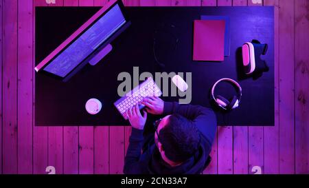 Professional hacker using mobile cell phone talking and spreadin Stock Photo