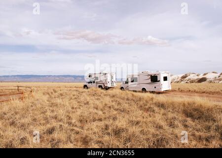 Two RV driving on road in White Sands National Park Stock Photo