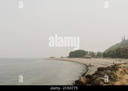 The beach at Golden Gardens Park engulfed in wildfire smoke Stock Photo
