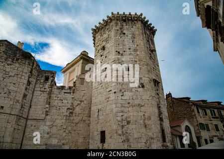 Hexagonal tower and defensive wall, with facades full of windows Stock Photo