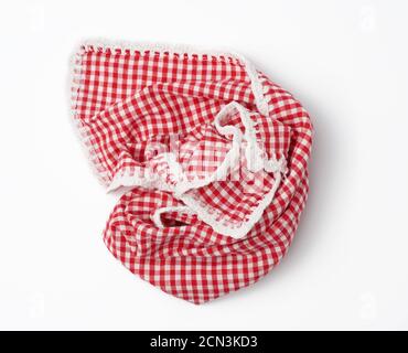 crumpled kitchen red-white towel in on a white background Stock Photo