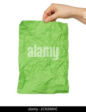 female hand hold empty crumpled green rectangular sheet of paper a4 Stock Photo