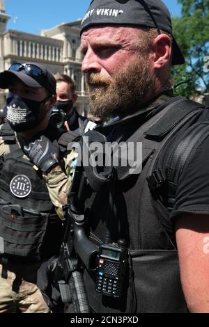 Louisville, KY, USA. 5th Sep, 2020. Dylan Stevens of the Angry Viking group engages with a protester in downtown Louisville, KY. Stock Photo