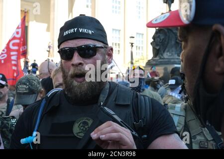 Louisville, KY, USA. 5th Sep, 2020. Dylan Stevens of the Angry Viking group engages with a protester in downtown Louisville, KY. Stock Photo