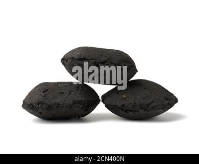 pile of black square briquettes of pressed charcoal for barbecue and bonfires Stock Photo