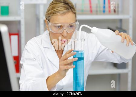 senior female biologist works in a modern laboratory Stock Photo