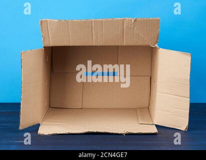 open empty brown rectangular cardboard box for transporting goods Stock Photo