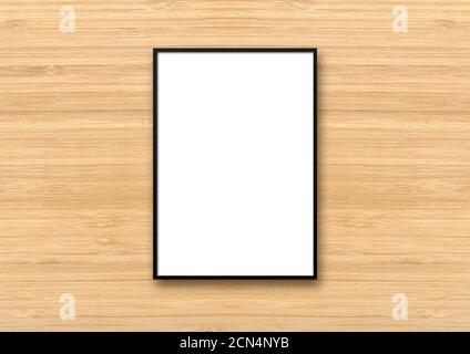 Black picture frame hanging on a light wooden wall Stock Photo