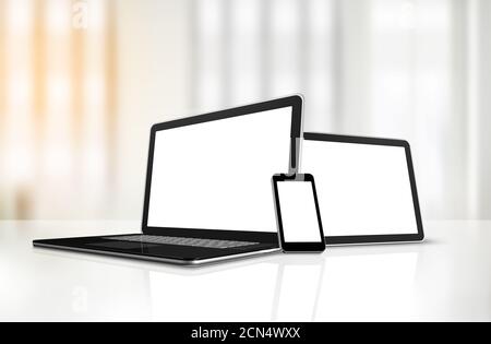 Laptop, mobile phone and digital tablet pc on office desk Stock Photo