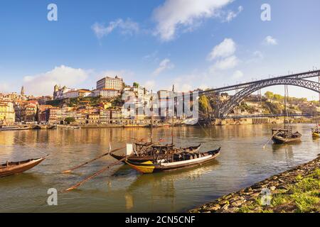 Porto Portugal city skyline at Porto Ribeira and Douro River with Rabelo wine boat Stock Photo