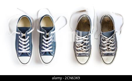 New and old blue sneakers isolated on white background Stock Photo