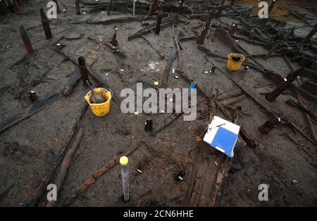 An Archaeologists From The University Of Cambridge Archaeological Unit ...