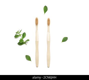two wooden toothbrushes on a white background, plastic rejection concept Stock Photo