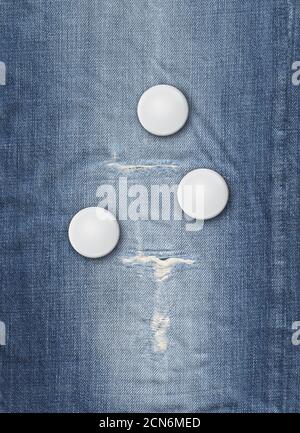 Three badges on a blue denim background Stock Photo