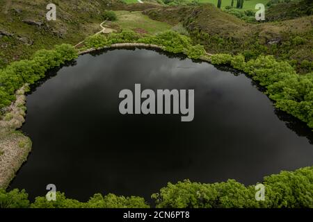 The dark surface of Diamond Lake in New Zealand Stock Photo