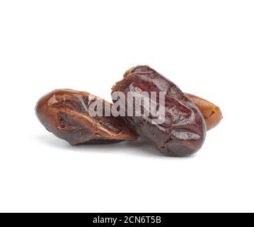 pile of dried dates isolated on white background Stock Photo