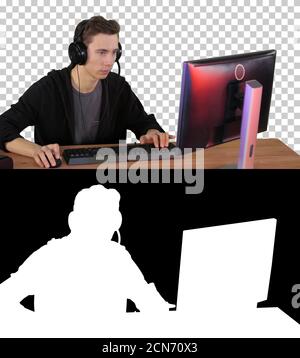 Concentrated angry brunette man playing video game, Alpha Channe Stock Photo