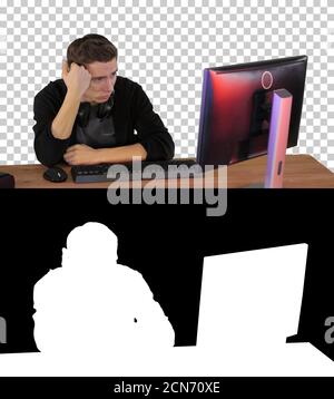 Upset gamer expressing disappointment watching online game, Alph Stock Photo