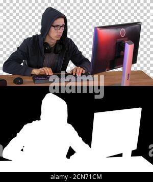 Hacker in glasses breaking code, Alpha Channel with Silhouette Stock Photo
